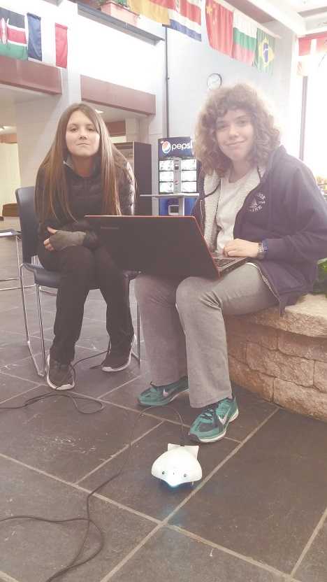 From left to right: Kiley Young and Amelia Fisher with Finch Robot.