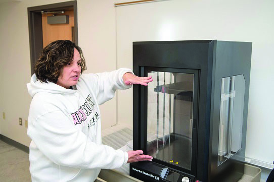 Christine Delahanty and a 3-D Printer
Photo Credit: Bridget Neirotti